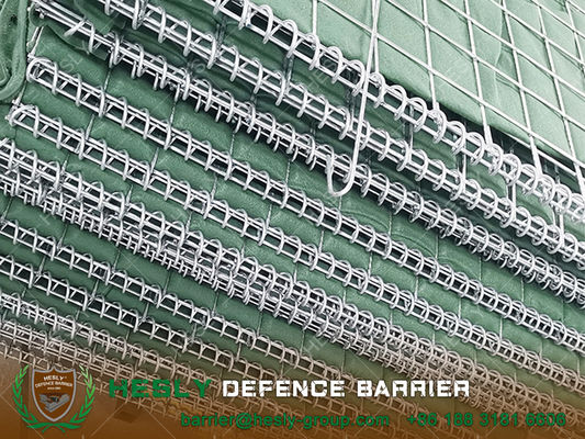 Barrière défensive récupérable de couleur beige revêtue de géotextile. fournisseur