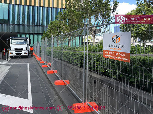 Système de clôture temporaire HESLY. Un support en acier. Un bloc en plastique orange. fournisseur